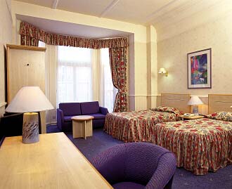 A twin room at Barkston Gardens Hotel